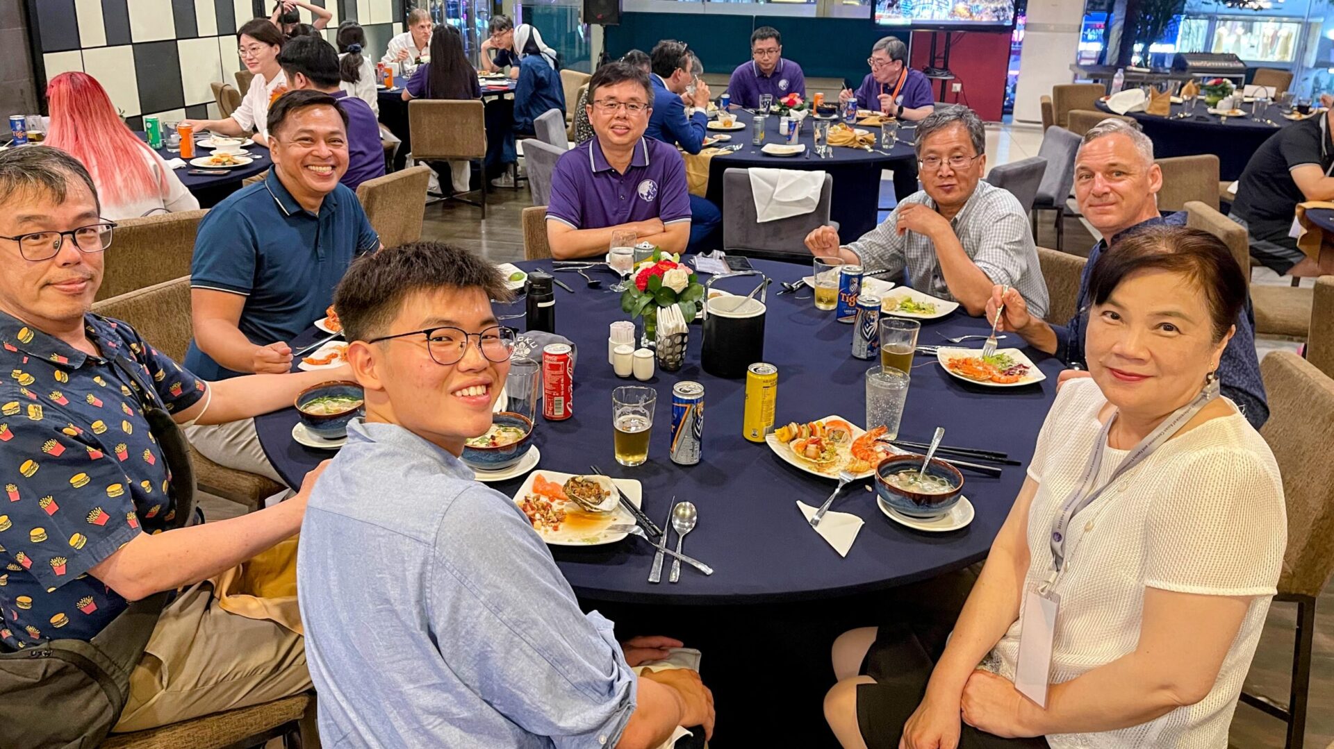 Ned Legaspi with a co-presenter and fellow scholars during the welcome dinner of the 15th Biennial ACFEA Conference in Hanoi, Vietnam.