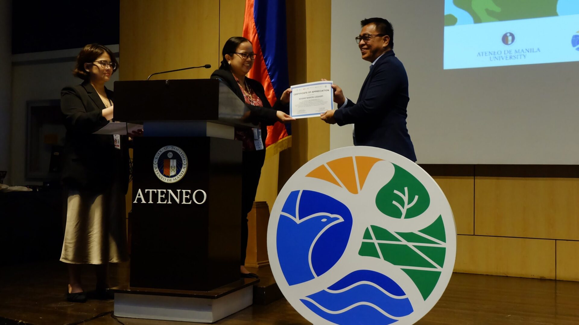 Ned Legaspi receives a certificate of appreciation after presenting at the 2025 AUN-EEC Conference at Ateneo de Manila University.