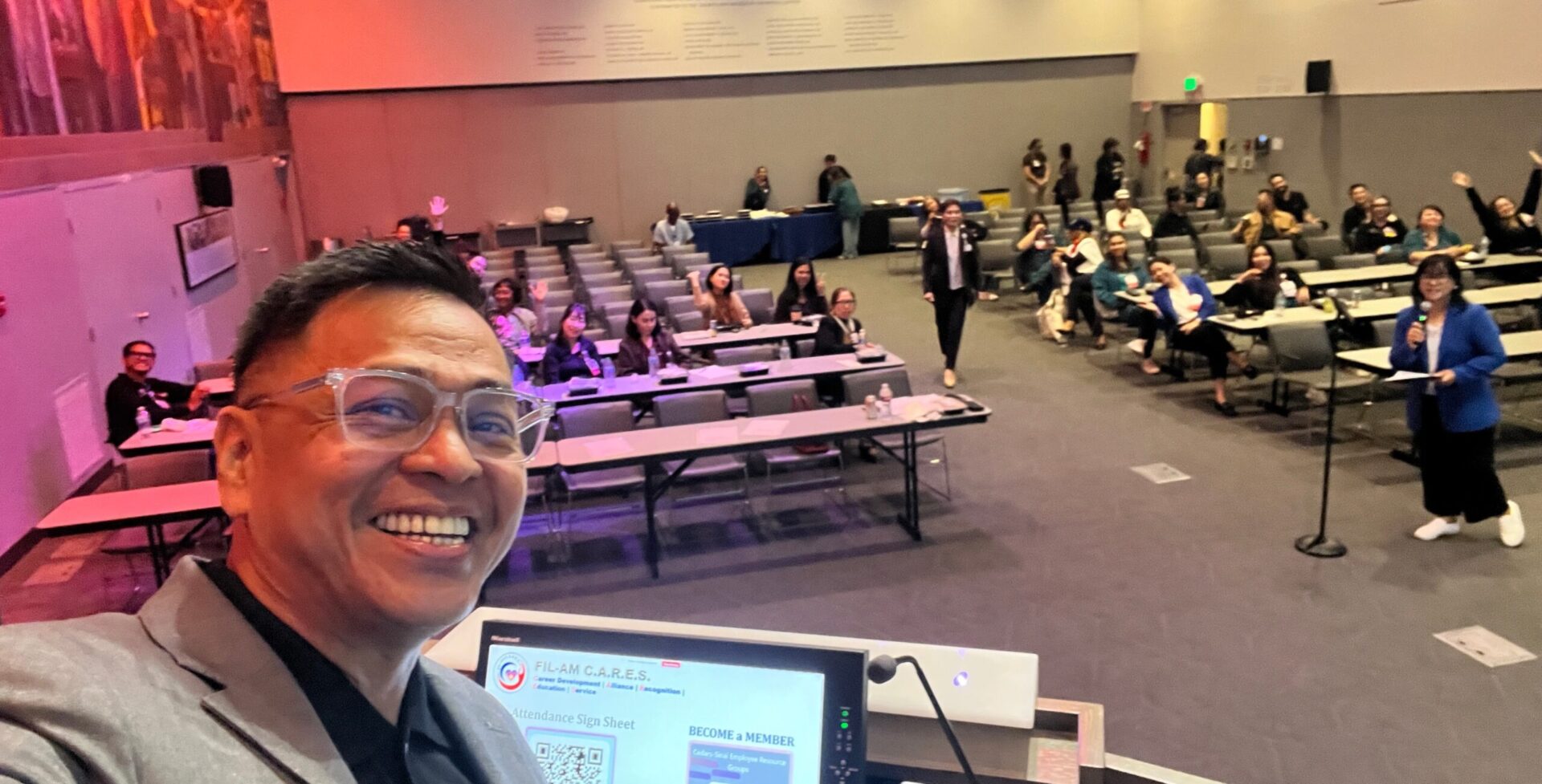 Ned Legaspi taking a selfie with healthcare professionals attending his Cultural Intelligence session at Cedars-Sinai.