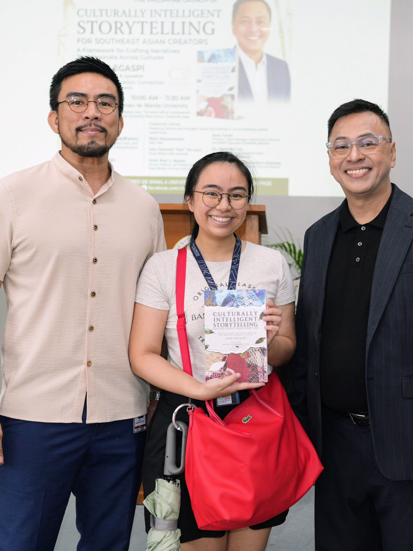 Ali Sulit and Anika with a copy of Culturally Intelligent Storytelling for Southeast Asian Creators