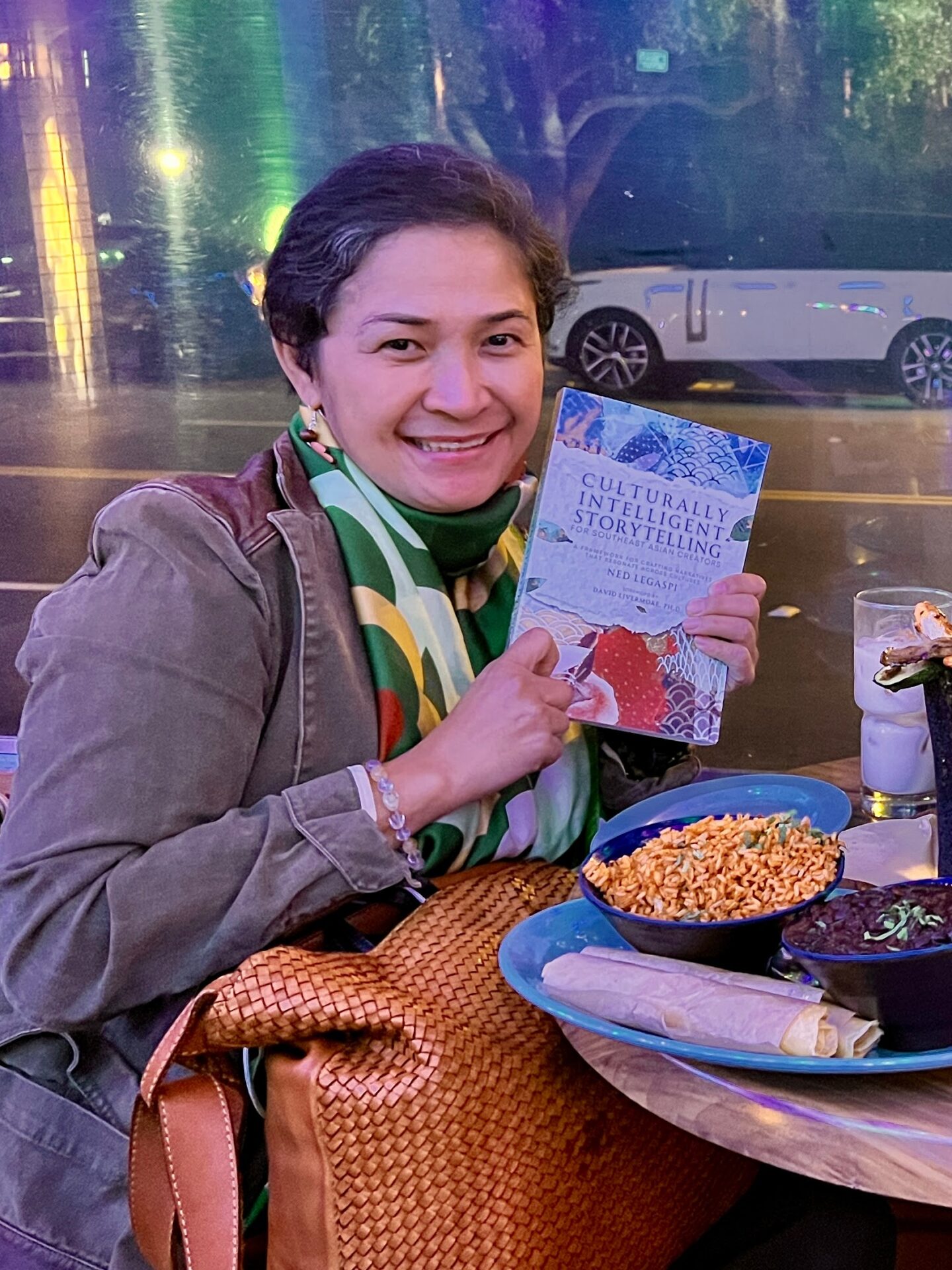 Charina Vergara with a copy of Culturally Intelligent Storytelling for Southeast Asian Creators