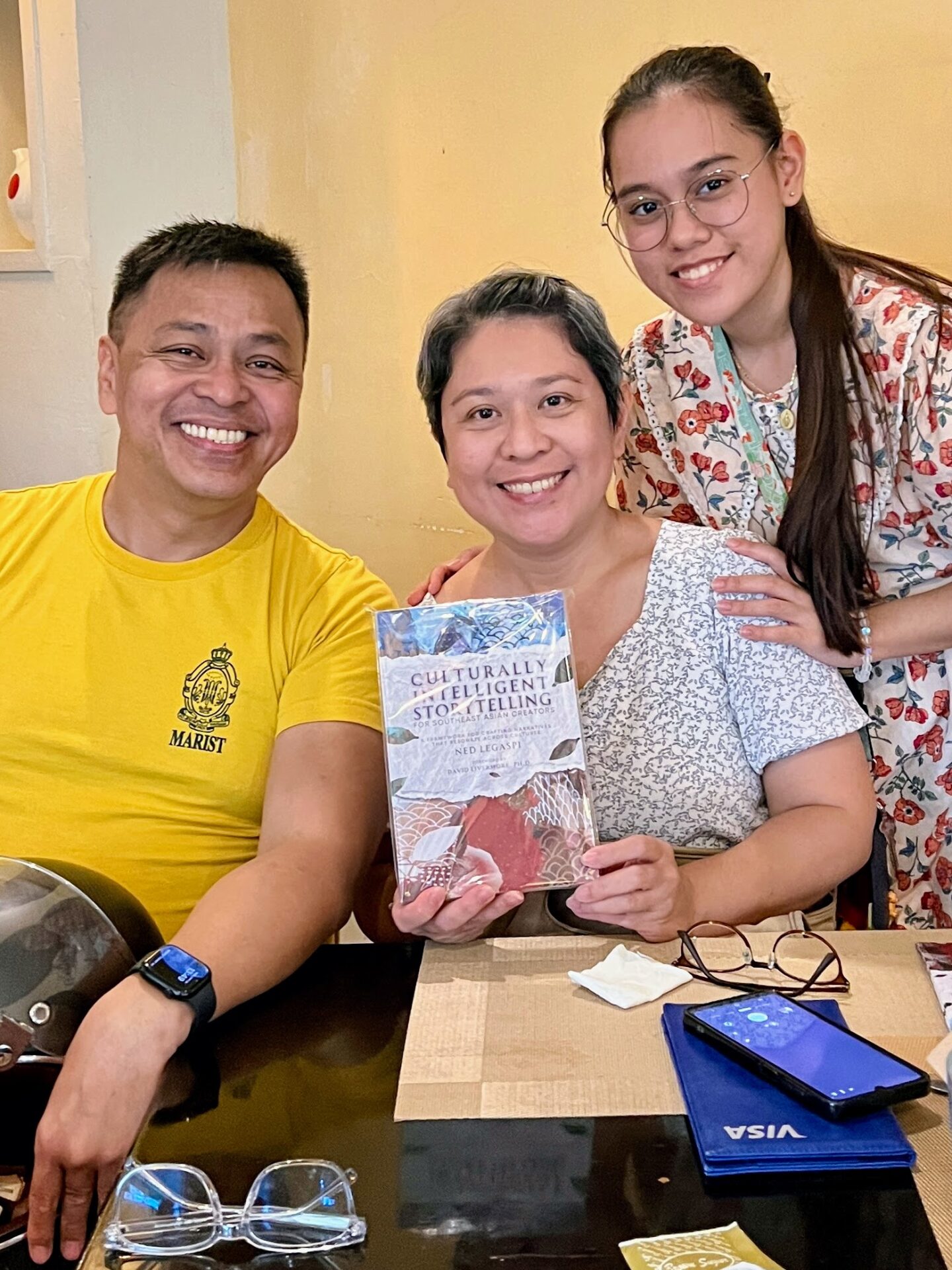 Jen Villacorte Dadivas and Bea with a copy of Culturally Intelligent Storytelling for Southeast Asian Creators