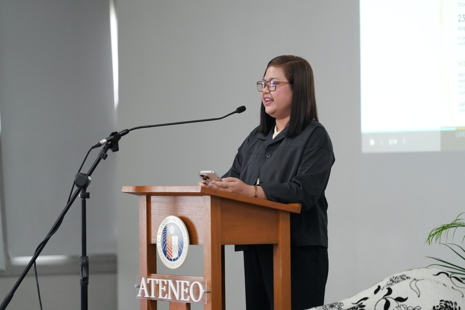 University Librarian Joenabie E. Arevalo delivers the opening remarks at the Ateneo Philippine book launch