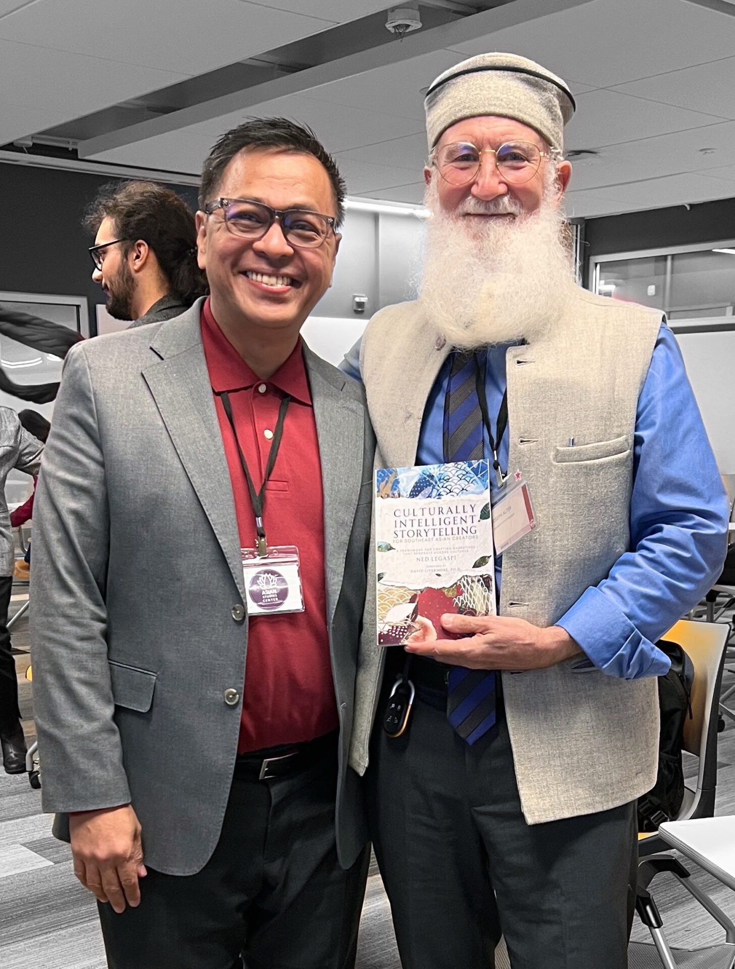 Joseph Alter with a copy of Culturally Intelligent Storytelling for Southeast Asian Creators