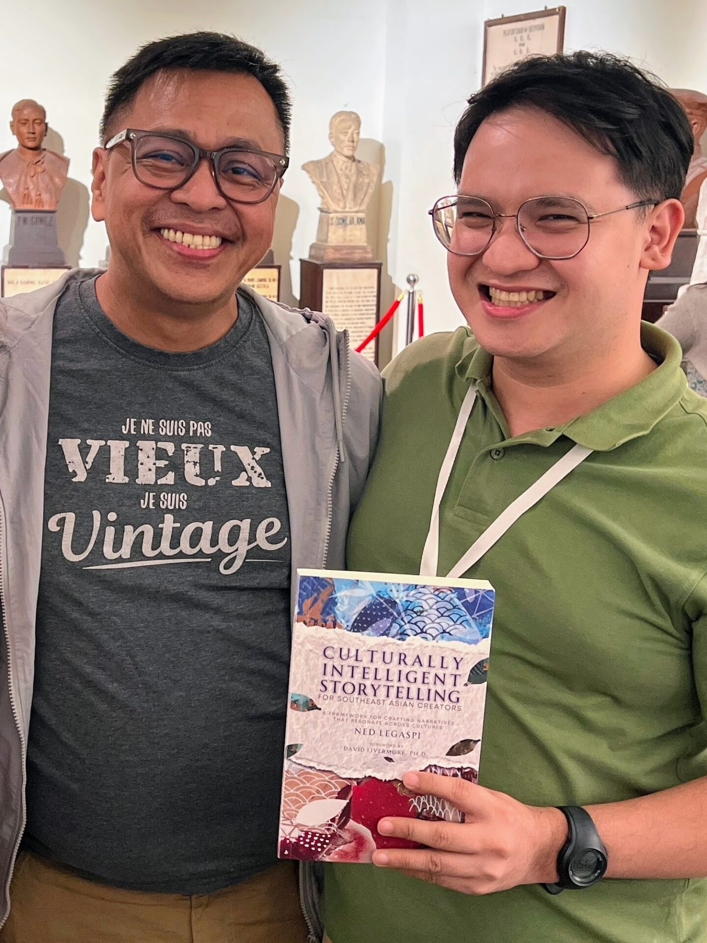 Joycel Vincent Dabalos with a copy of Culturally Intelligent Storytelling for Southeast Asian Creators