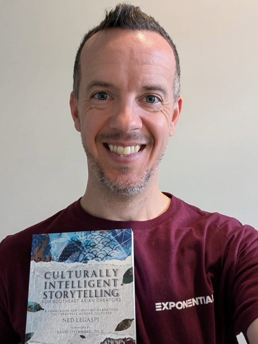 Matt Millar with a copy of Culturally Intelligent Storytelling for Southeast Asian Creators in Nairobi, Kenya