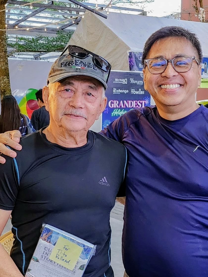Roland Aquino with a copy of Culturally Intelligent Storytelling for Southeast Asian Creators