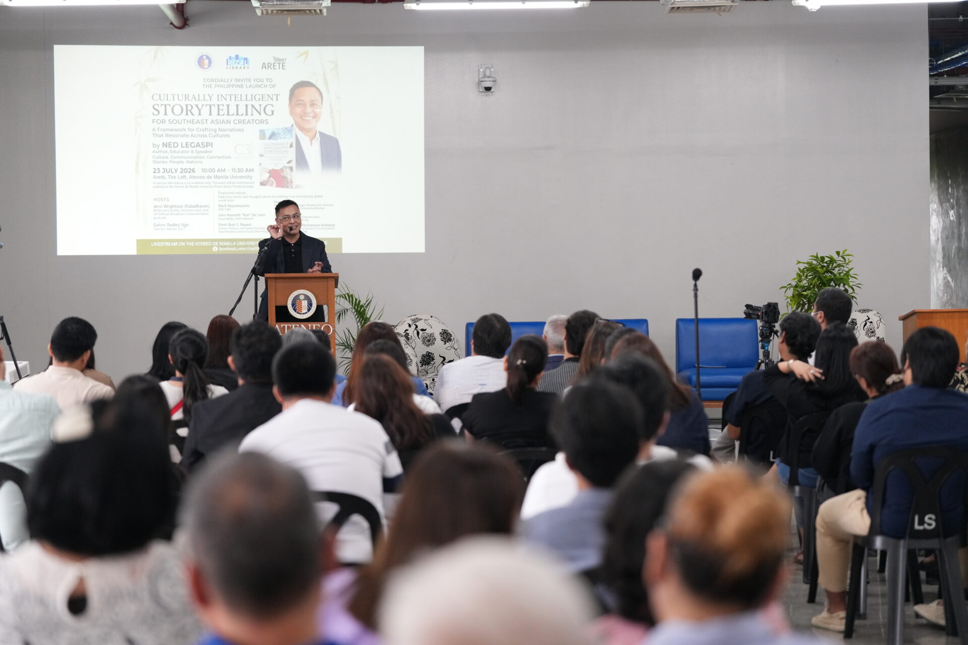 Ned Legaspi speaking before the audience at his Philippine book launch at Ateneo de Manila University