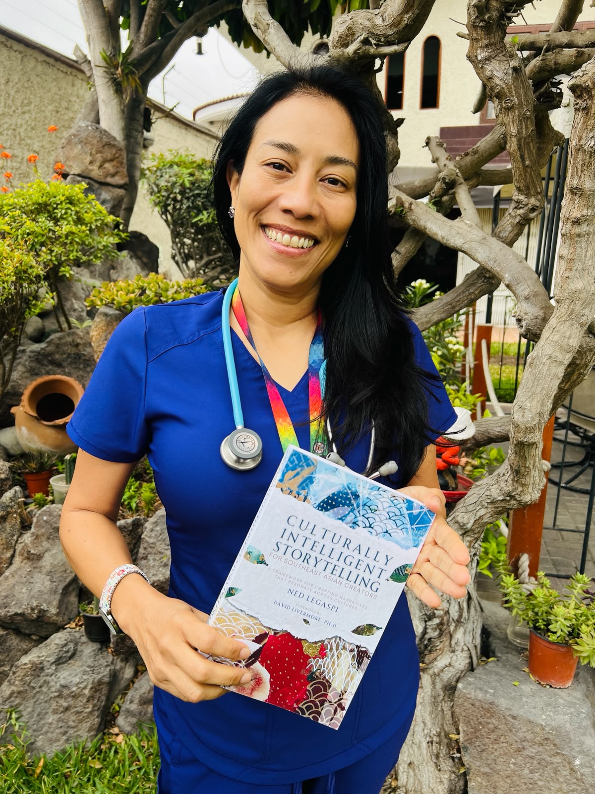 Suni Su with a copy of Culturally Intelligent Storytelling for Southeast Asian Creators in Lima, Peru