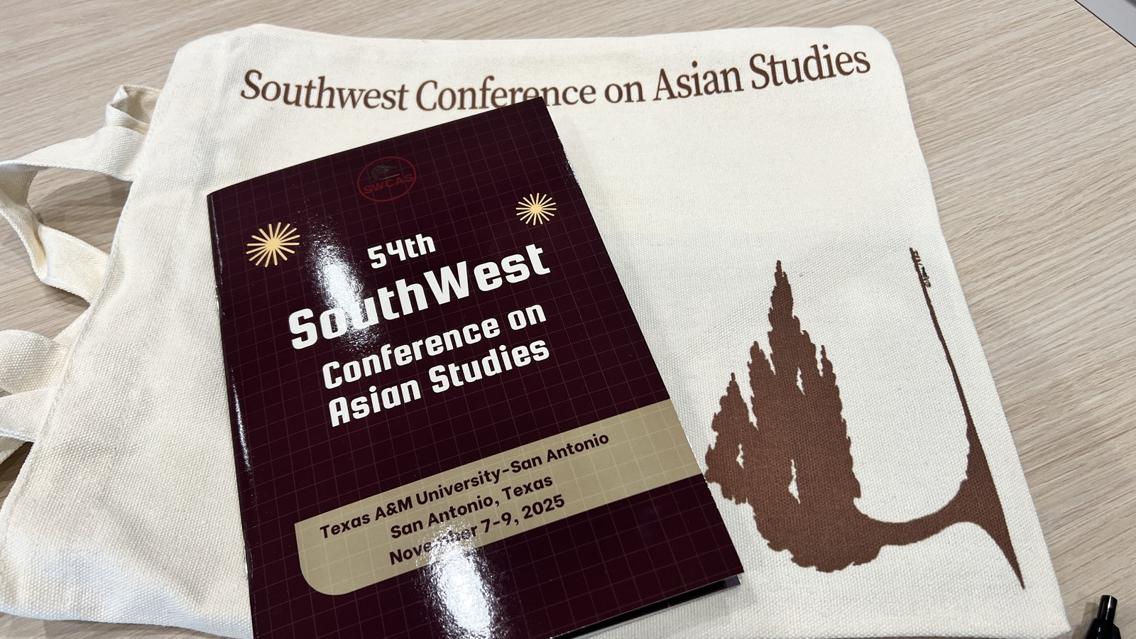 Conference program and tote bag from the 54th SouthWest Conference on Asian Studies in San Antonio, Texas